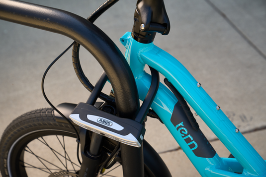 blue bike secured to bike rack with ABUS GRANIT XPLUS 54 Mini