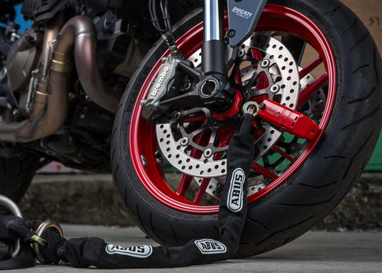 motorcycle locked with 8077 disc brake lock and loop chain