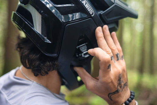 rider attaching chinbar to helmet