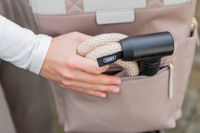 Load image into Gallery viewer, Person using a black lock transported in a beige bag #color_sand stone
