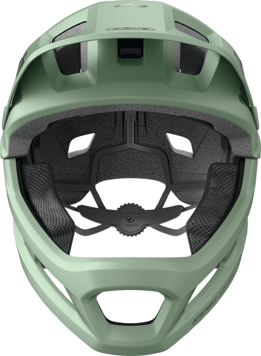 Close-up of a green helmet with visible branding on a white background