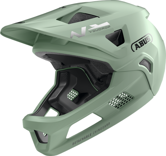Green full face helmet with ABUS branding on a white background