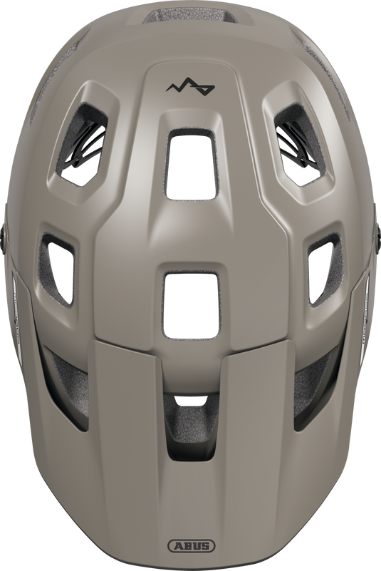 Tan helmet with a brand logo on a white background