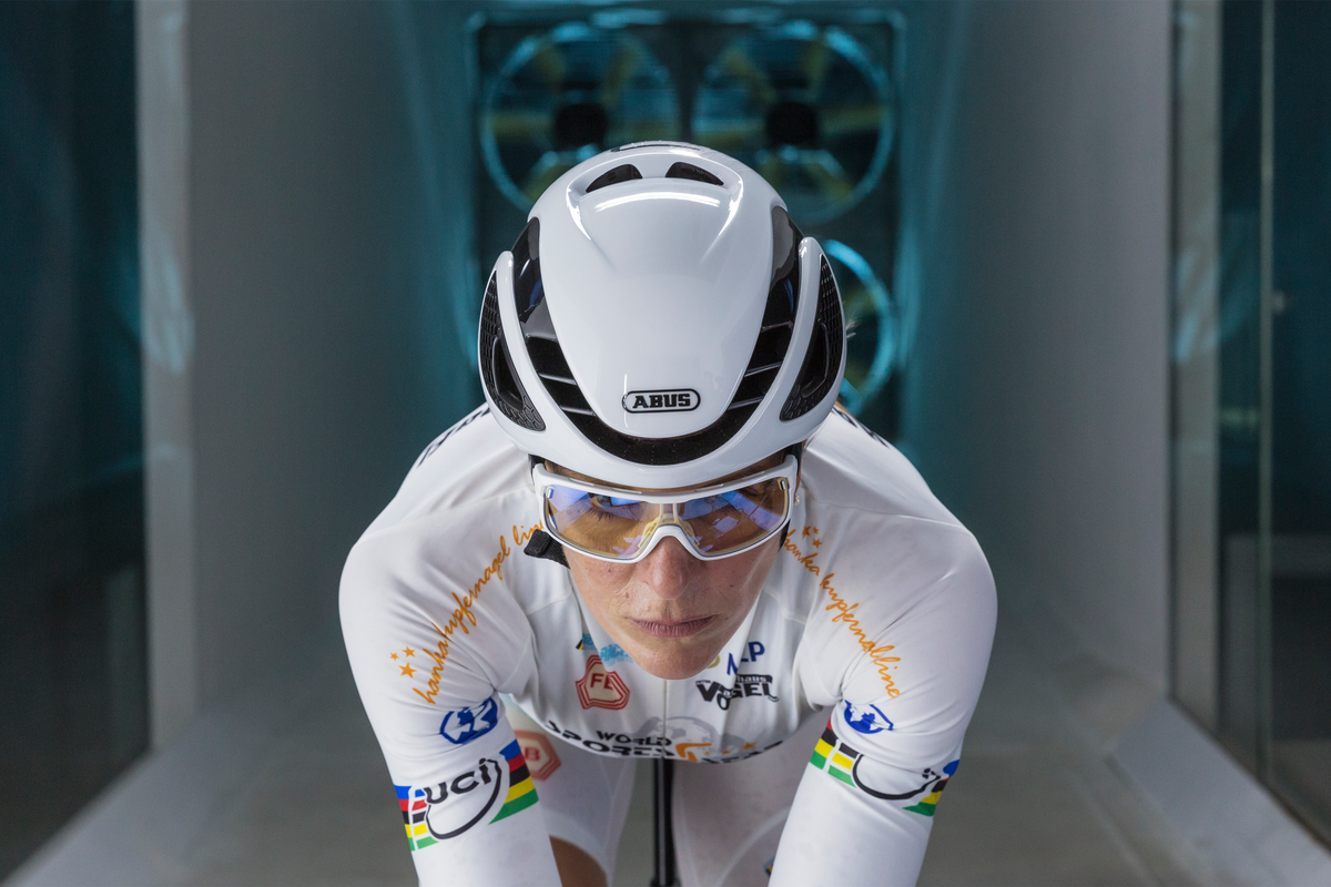 Cyclist in wind tunnel wearing white ABUS GameChanger helmet