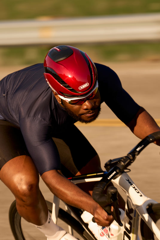 rider descending road wearing red GameChanger 2.0