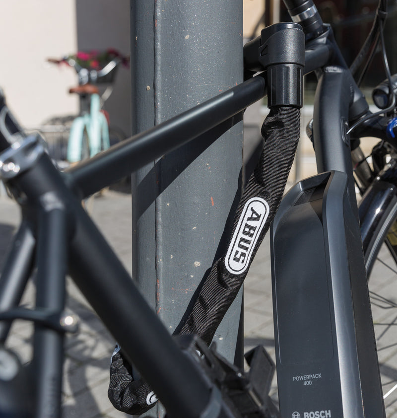 Load image into Gallery viewer, image of bike locked with 1010 chain
