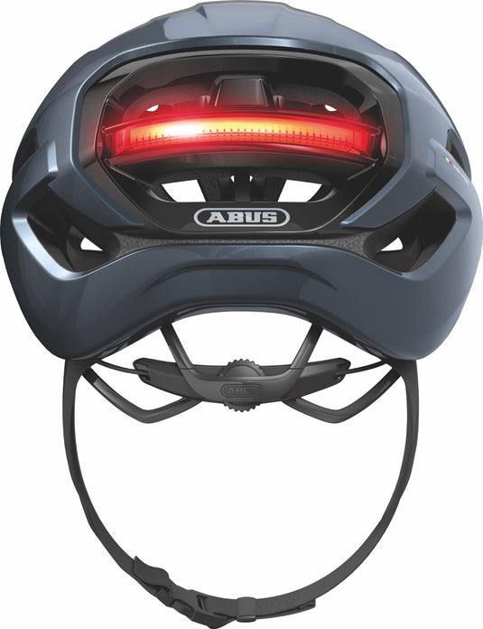 Blue helmet with a red light on a white background.