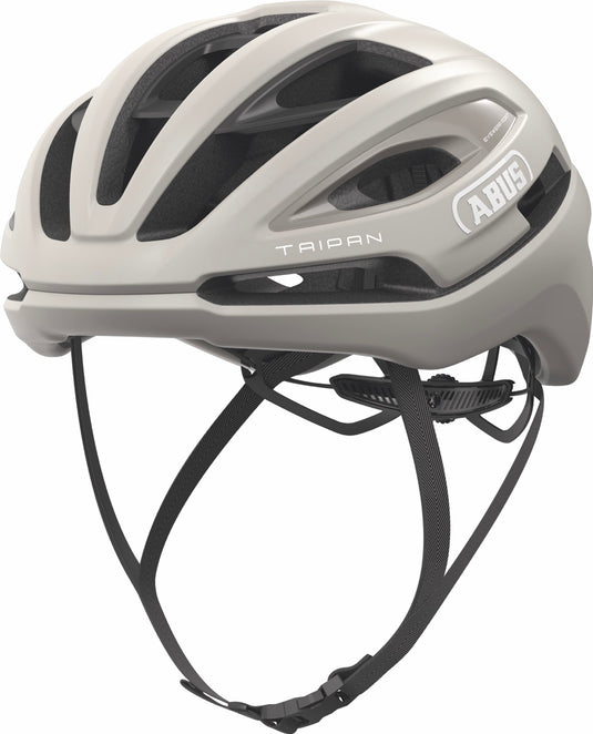 sand beige bicycle helmet with black straps on a white background