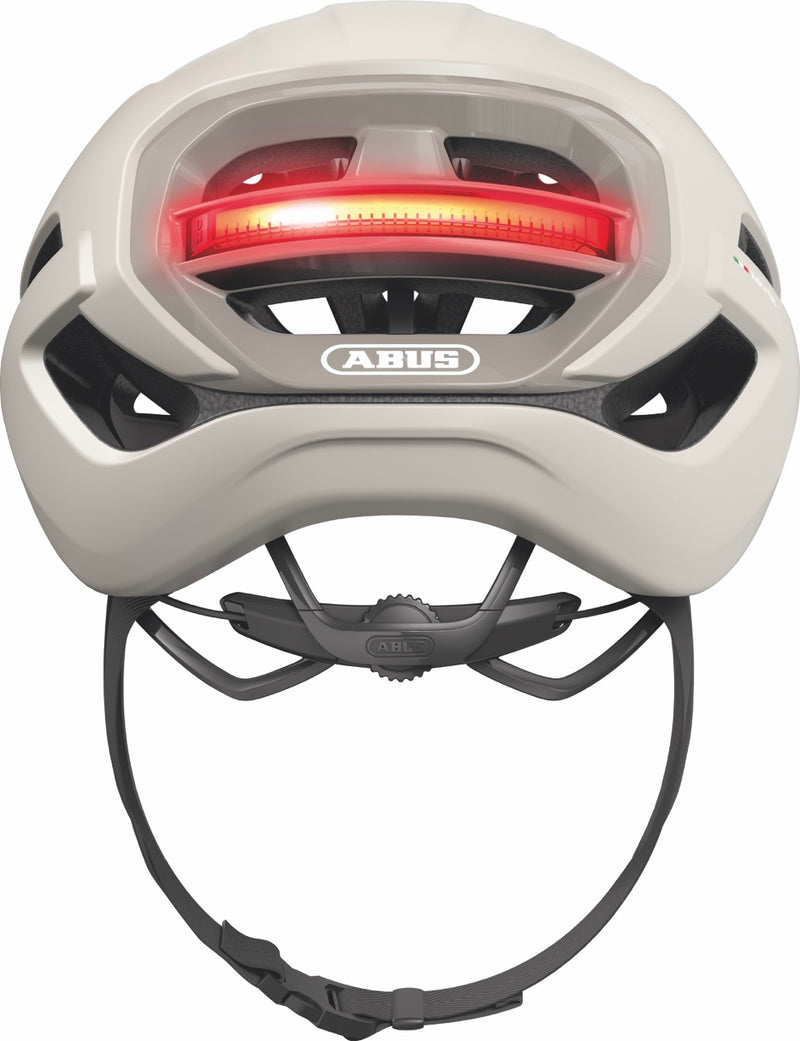 Load image into Gallery viewer, sand beige bicycle helmet with red light and ABUS logo on a white background #color_sand beige
