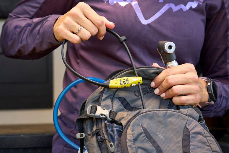 Load image into Gallery viewer, person pulling yellow CombiFlex TravelGuard from hydration pack #color_yellow
