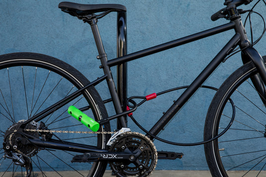 black bike locked to bike rack with 410 standard and cobra cable 